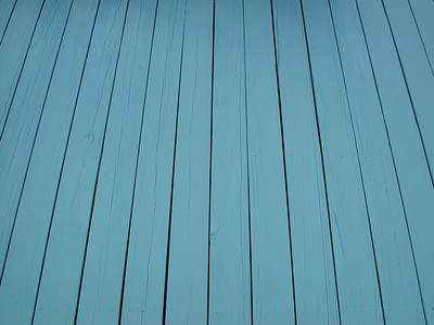 A wooden floor with a blue stain