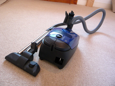 A cleaning equipment placed in a carpeted floor