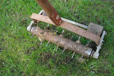 A gardening tool with spikes