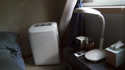 A mobile cooling appliance inside a bedroom