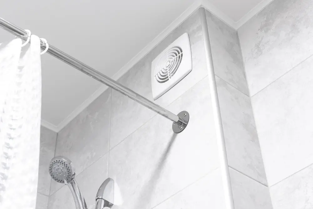 A ventilation system installed over a shower.