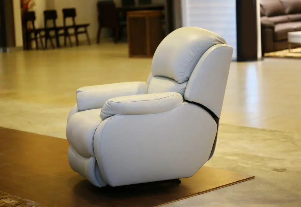 White sofa leather armchair with massage and foot rest