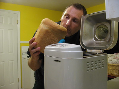 a man checking his warm bread