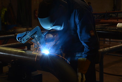 a man welding a pipe