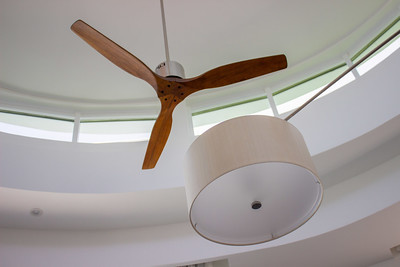 a wooden fan and a light