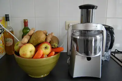 a-bowl-of-different-ingredients-beside-a-device