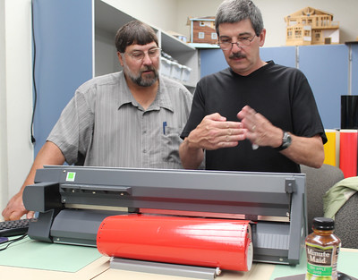 two men studying 3D printing